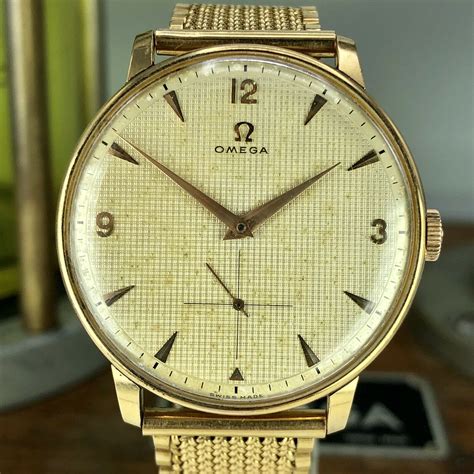 vintage omega solid gold watch